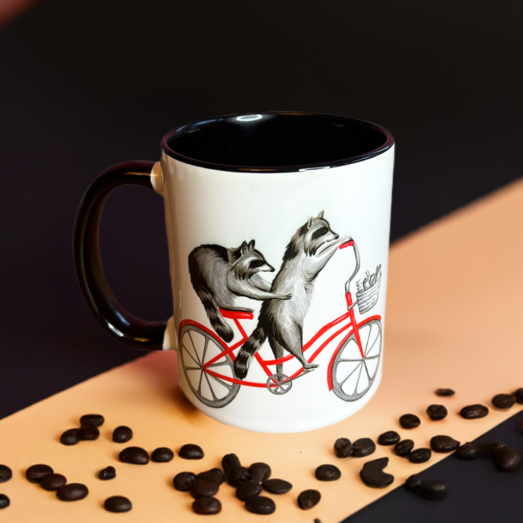 Raccoons riding a Bike Mug